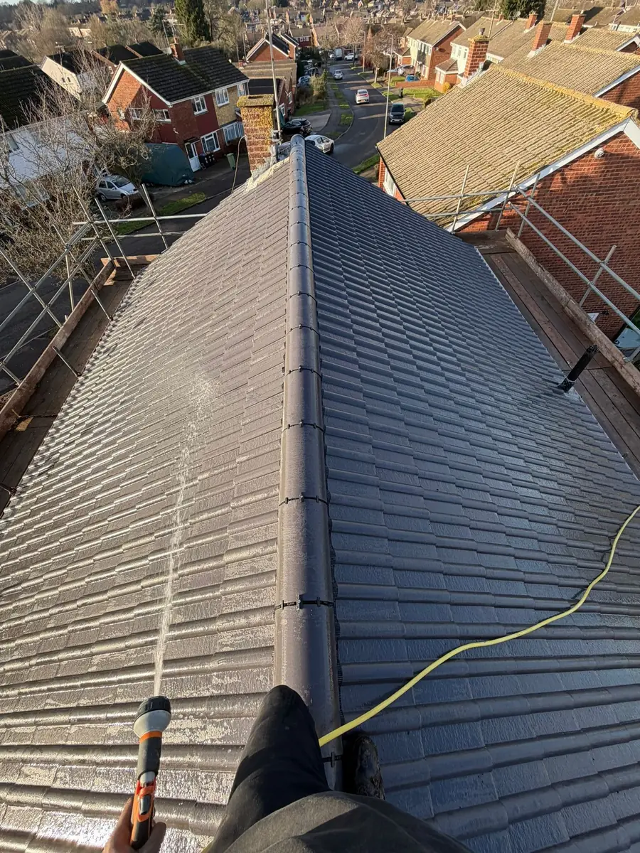 Brown tile roof with a long dry ridge run