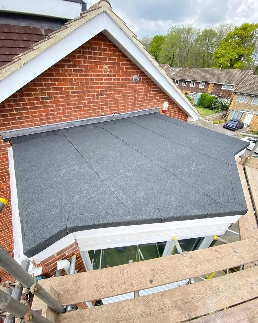 Felt flat roof on an extension, scaffold boards still in place