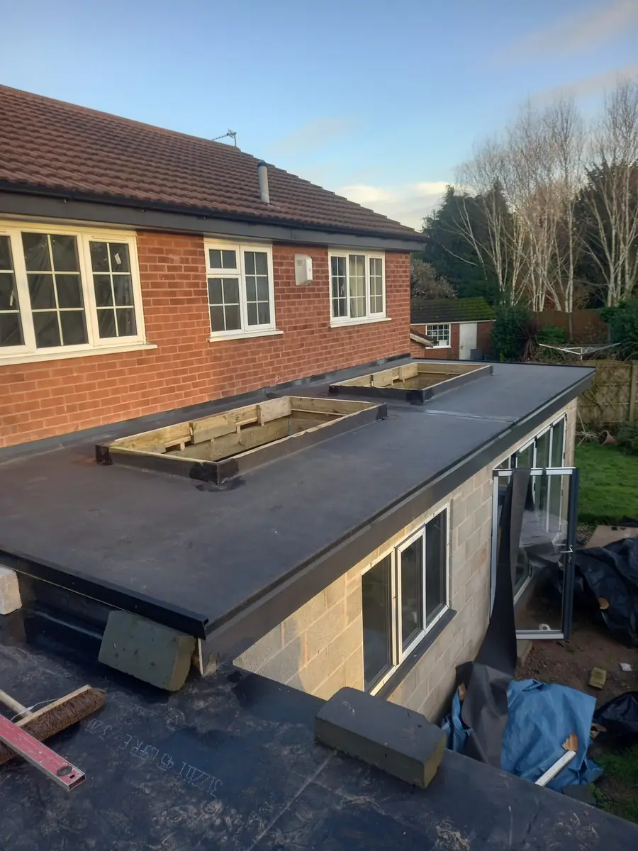New flat roof on a bungalow extension with rooflight upstands