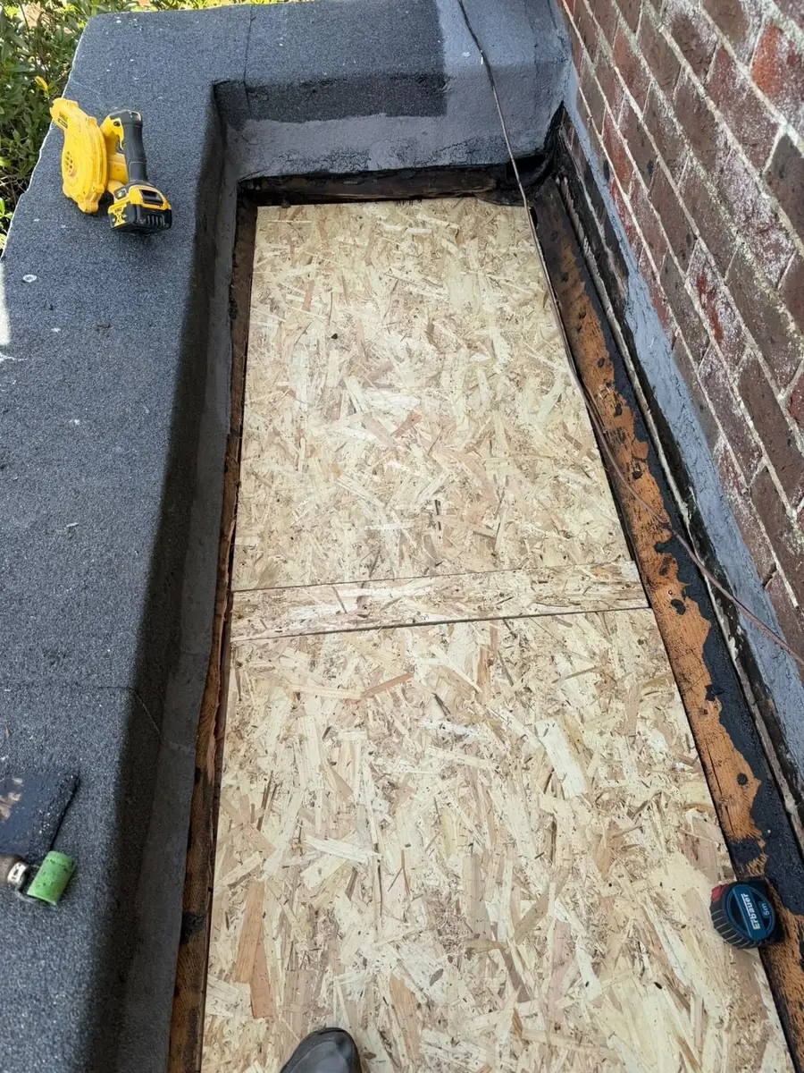 New OSB deck boards laid on a flat roof