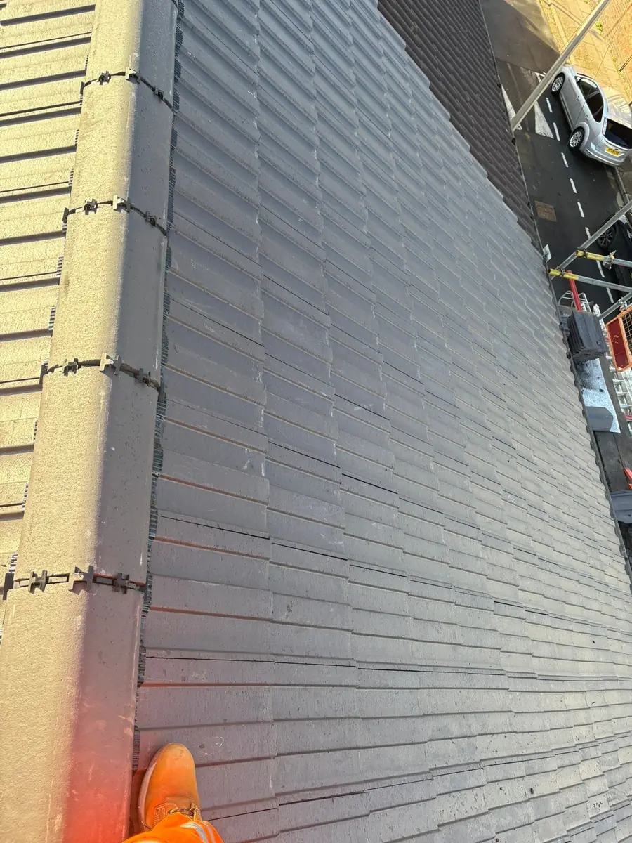 Close view of new grey slate-effect tiles