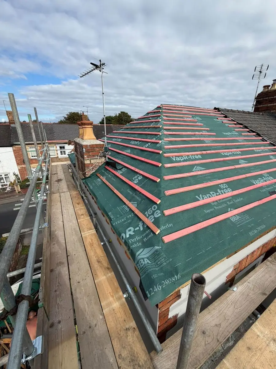 New membrane and battens on a hip roof, laps taped
