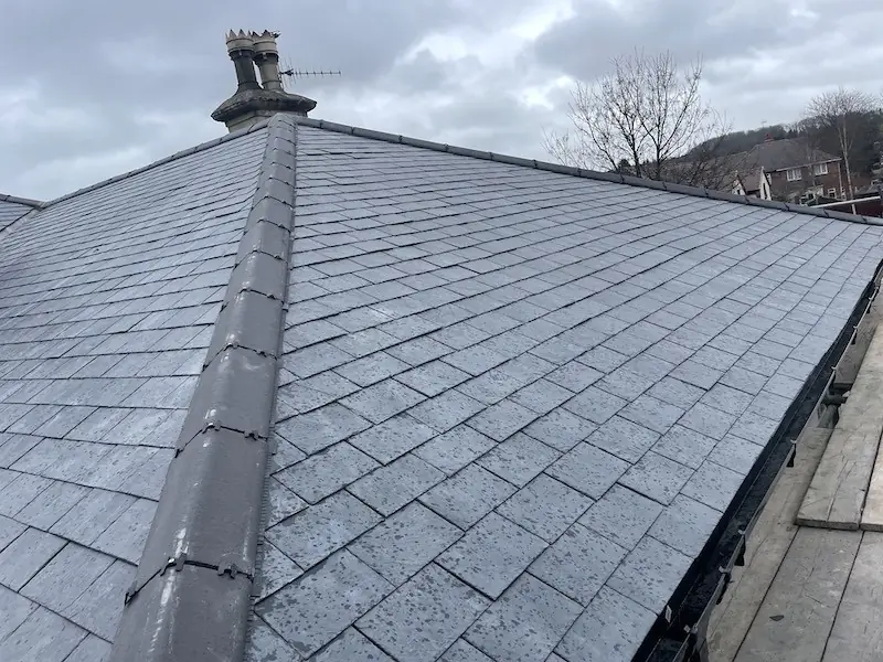 New slate roof with ridge and chimney