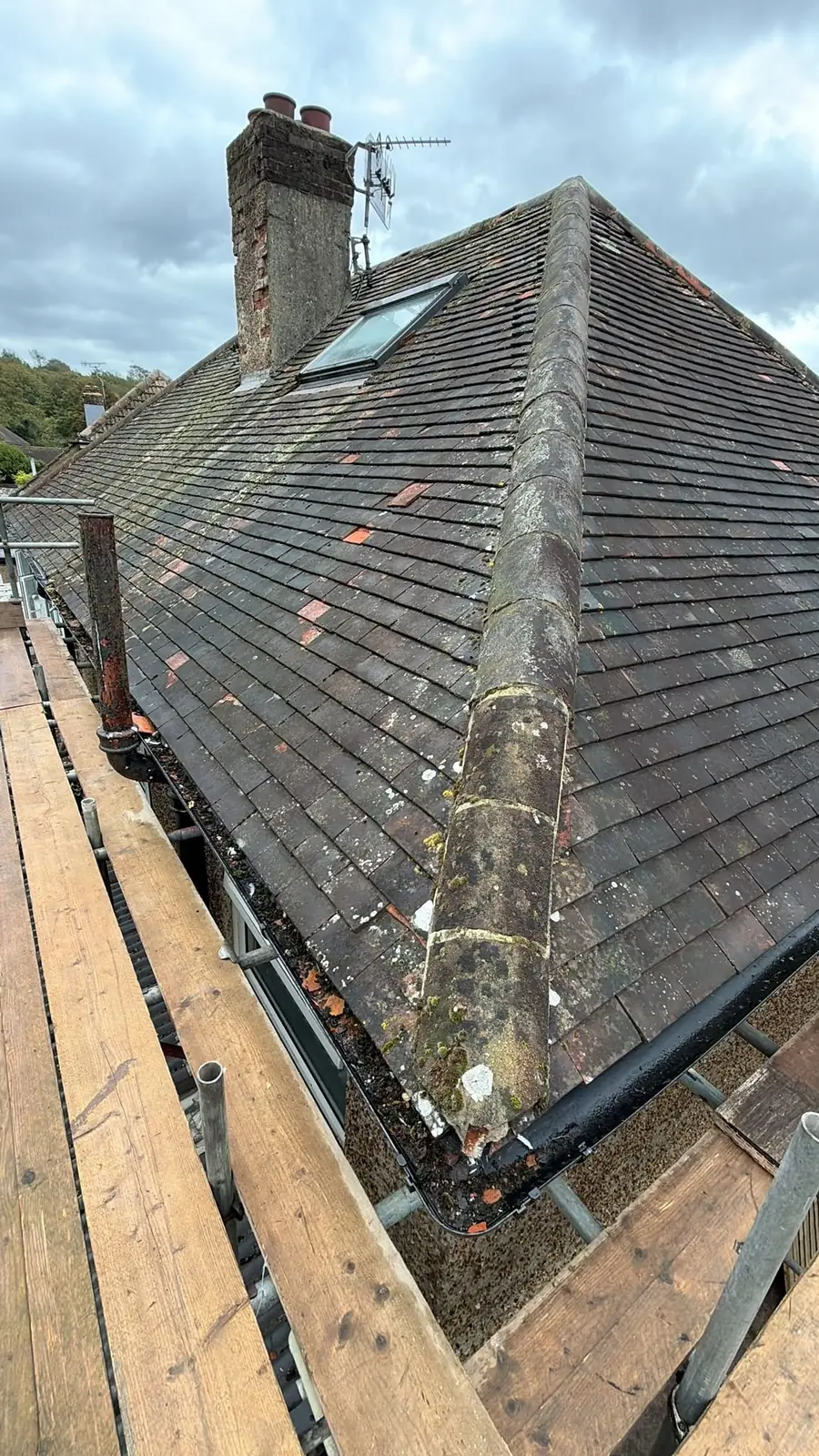 Old tired roof with a chimney before the strip began