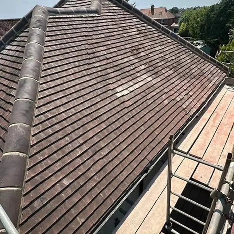 Plain tile roof finished with scaffold and ladder alongside