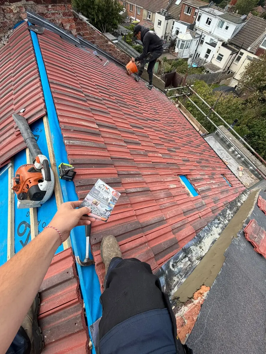 Red tile roof with the ridge being fixed from the top
