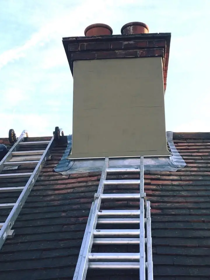 Rendered chimney stack with new lead flashing, roof ladder in place