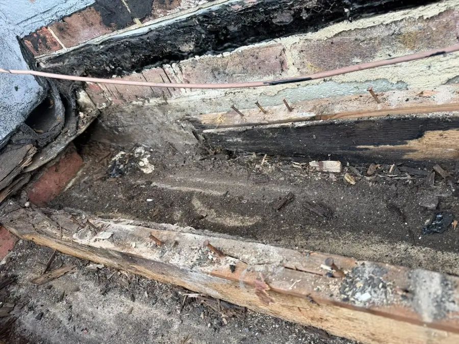 Rotten valley boards and battens exposed once the old tiles came off