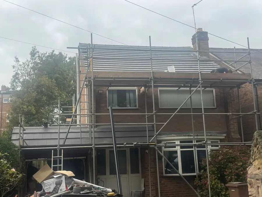 Semi-detached house with scaffold up for a re-roof